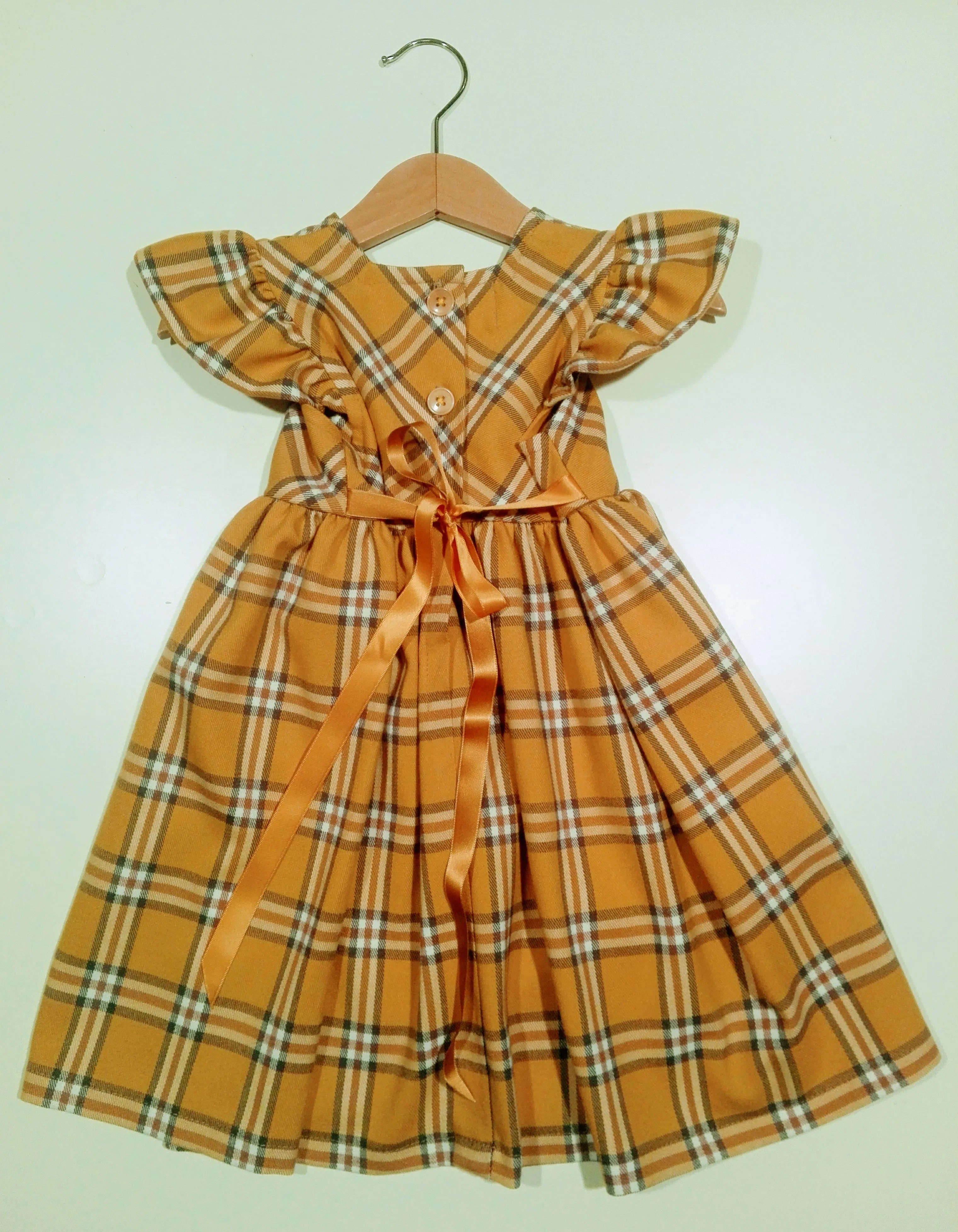Dress with curled sleeve in wool