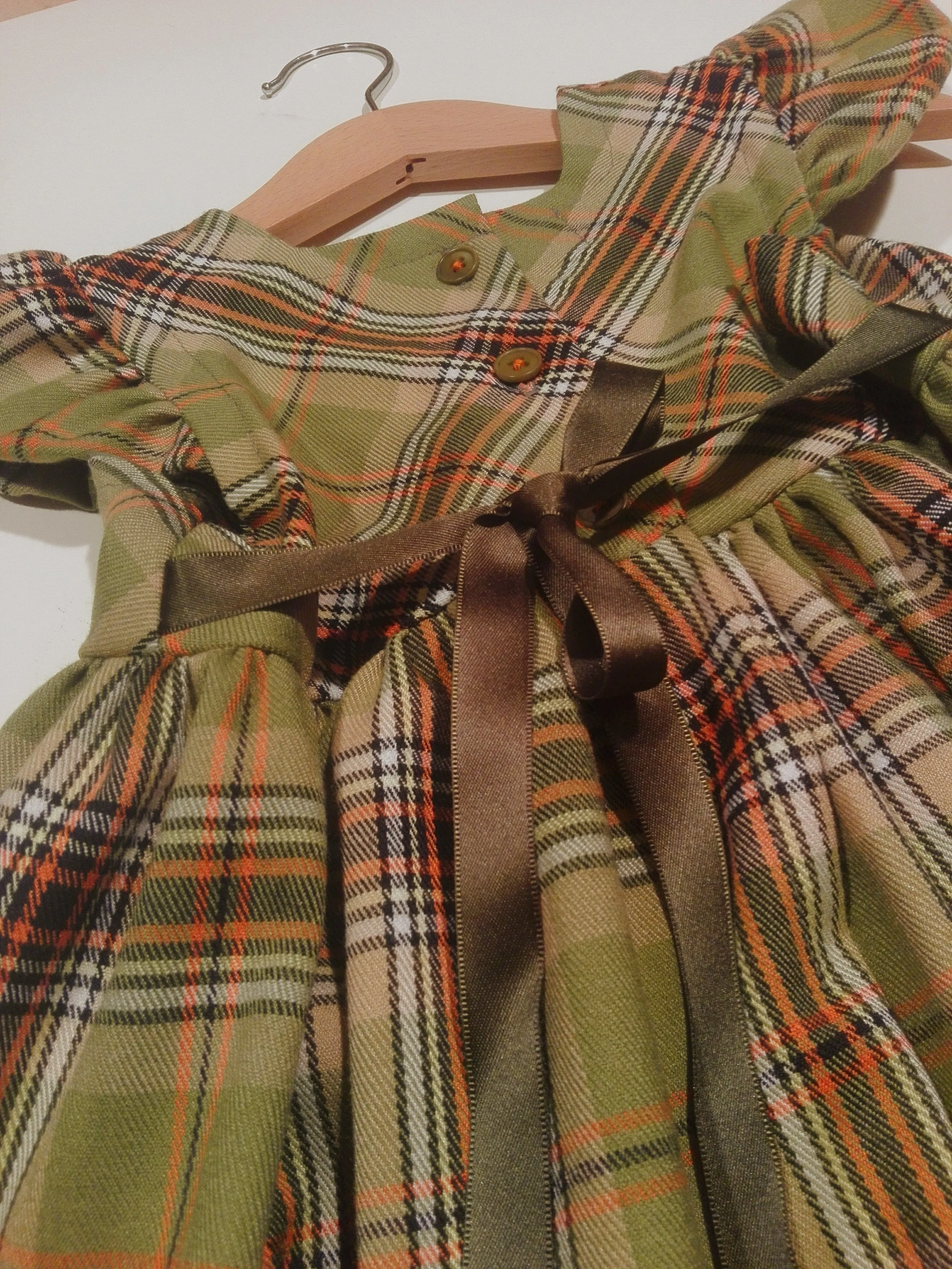 Dress with curled sleeve in wool