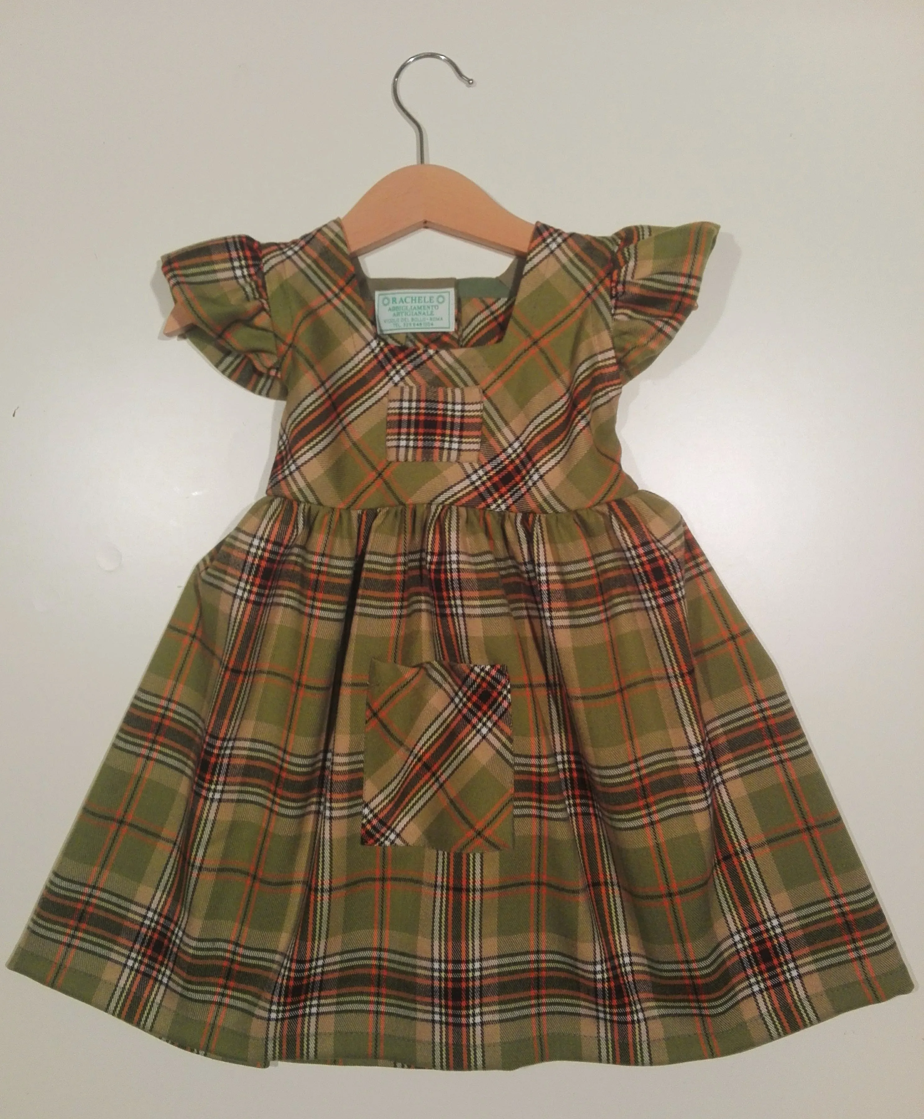 Dress with curled sleeve in wool