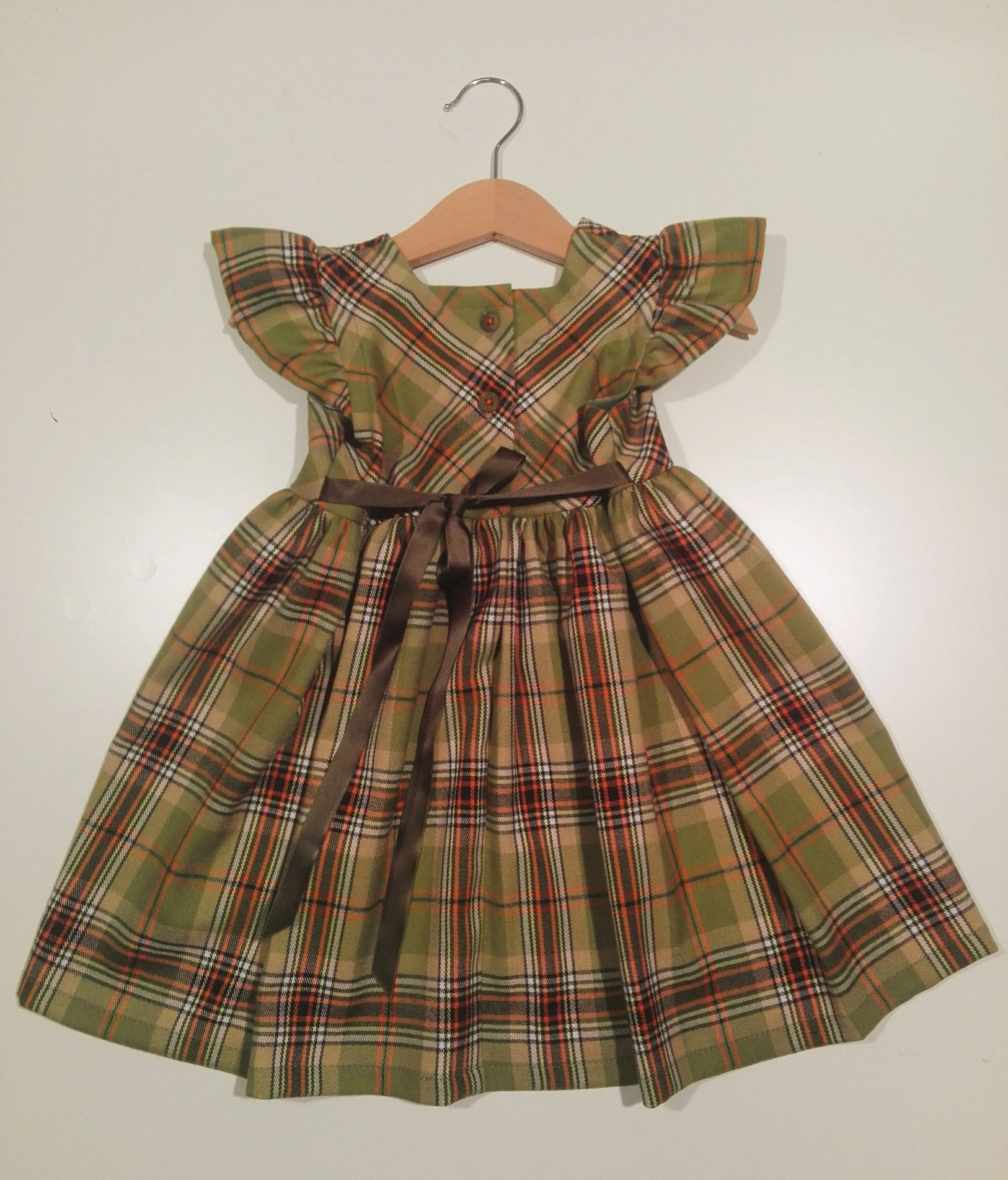 Dress with curled sleeve in wool