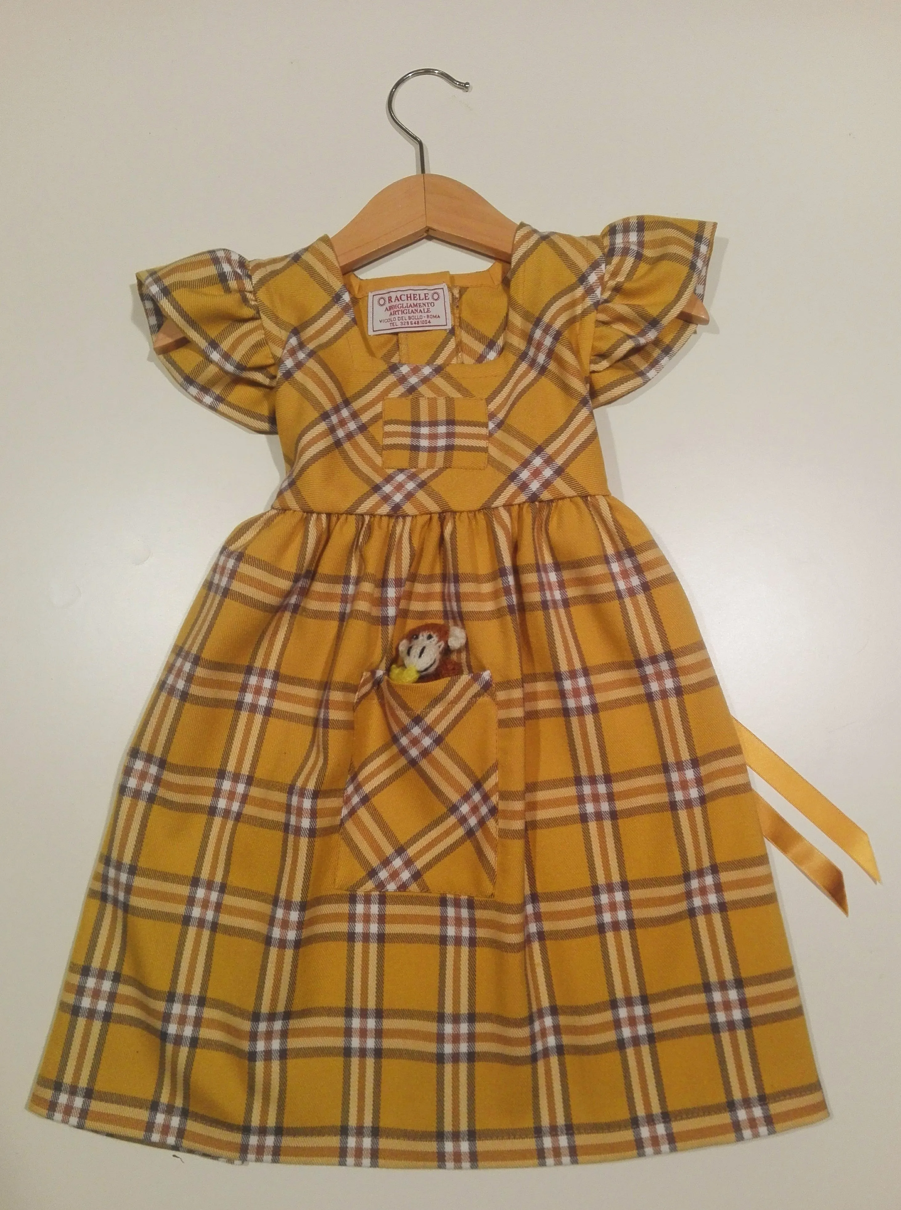 Dress with curled sleeve in wool