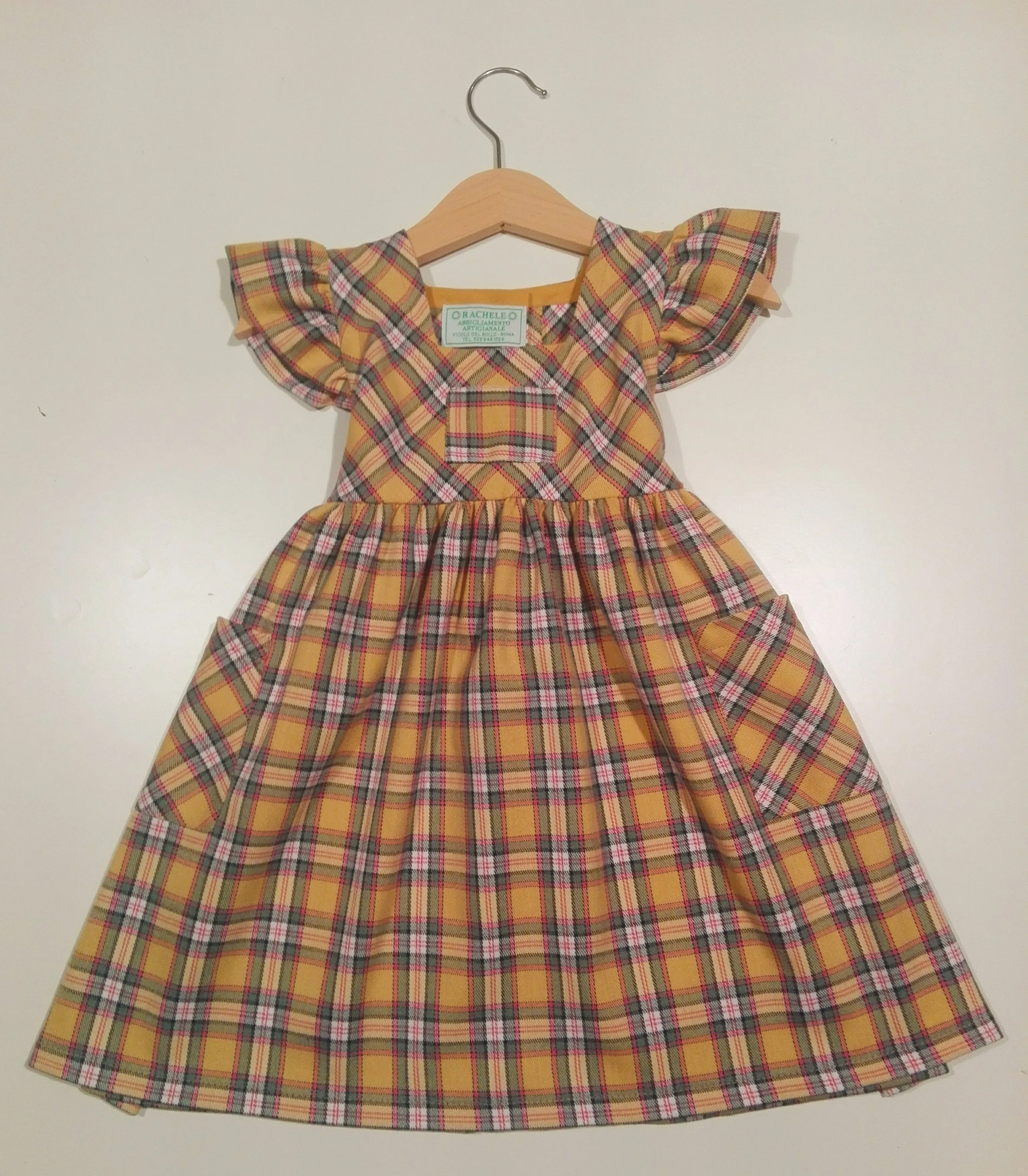 Dress with curled sleeve in wool