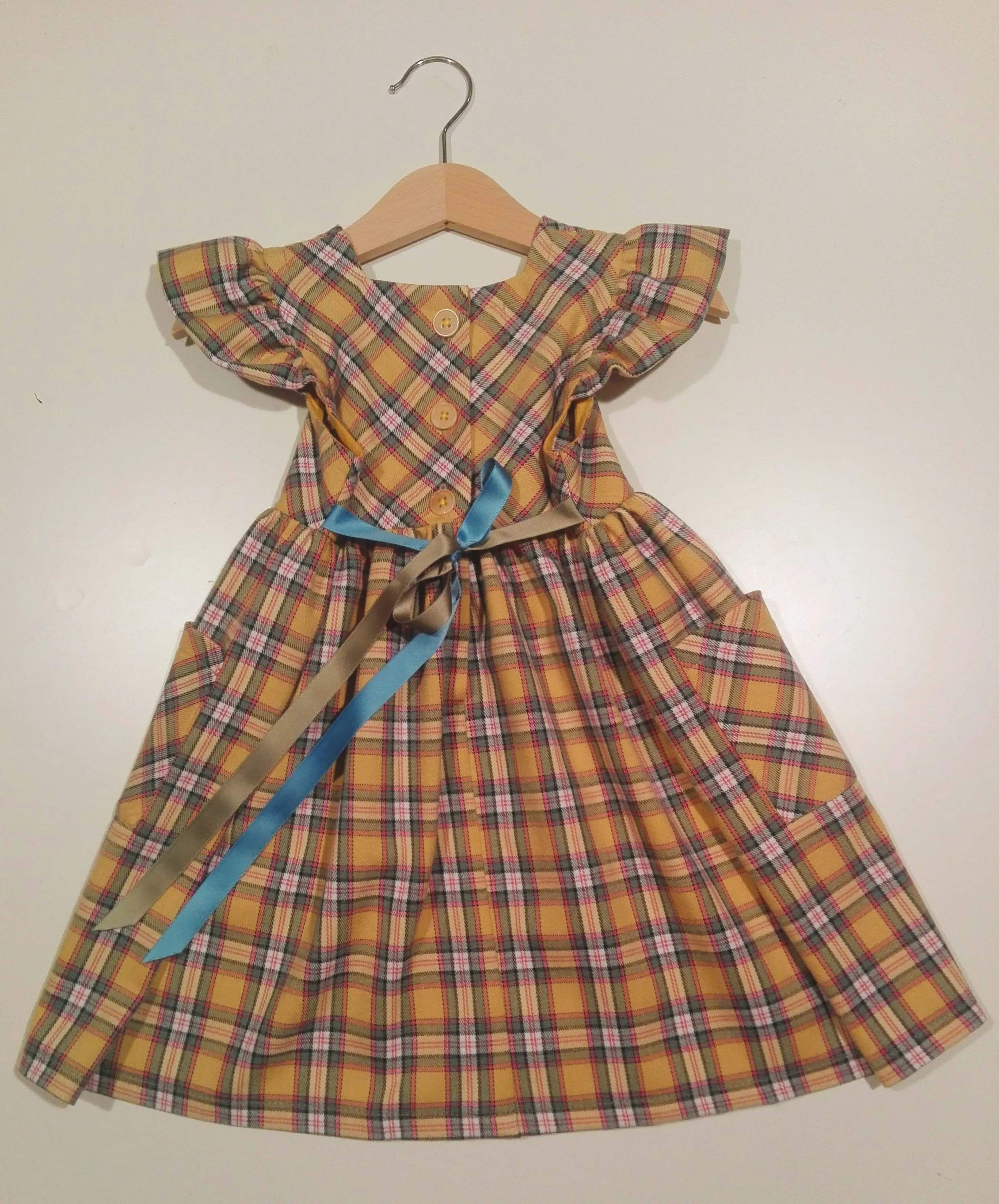 Dress with curled sleeve in wool
